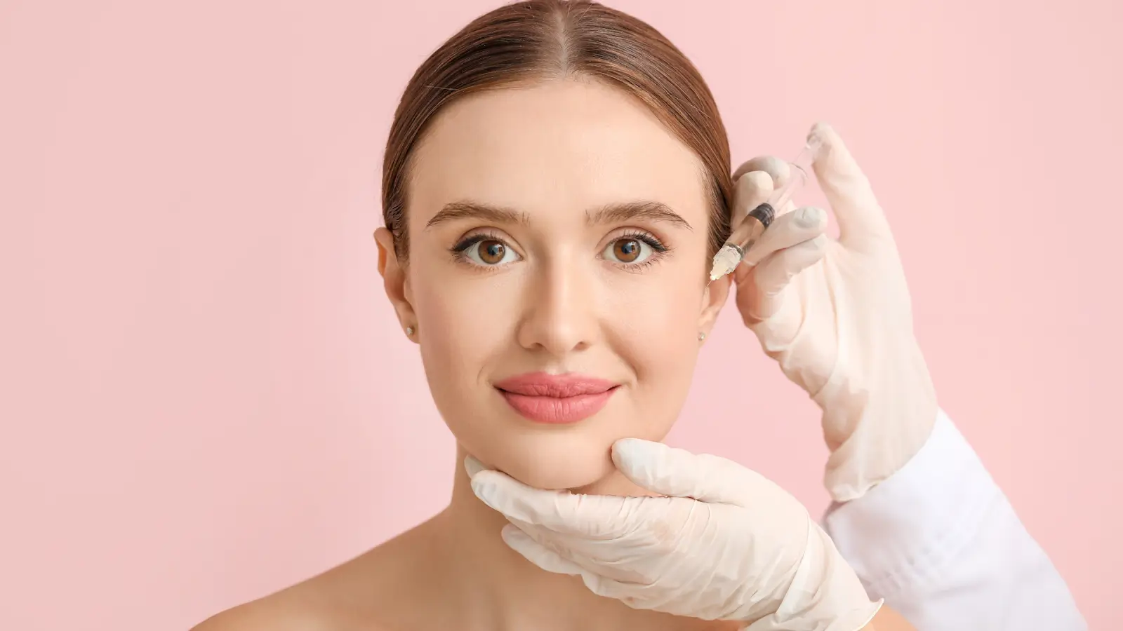 Woman with an injection near her face. 