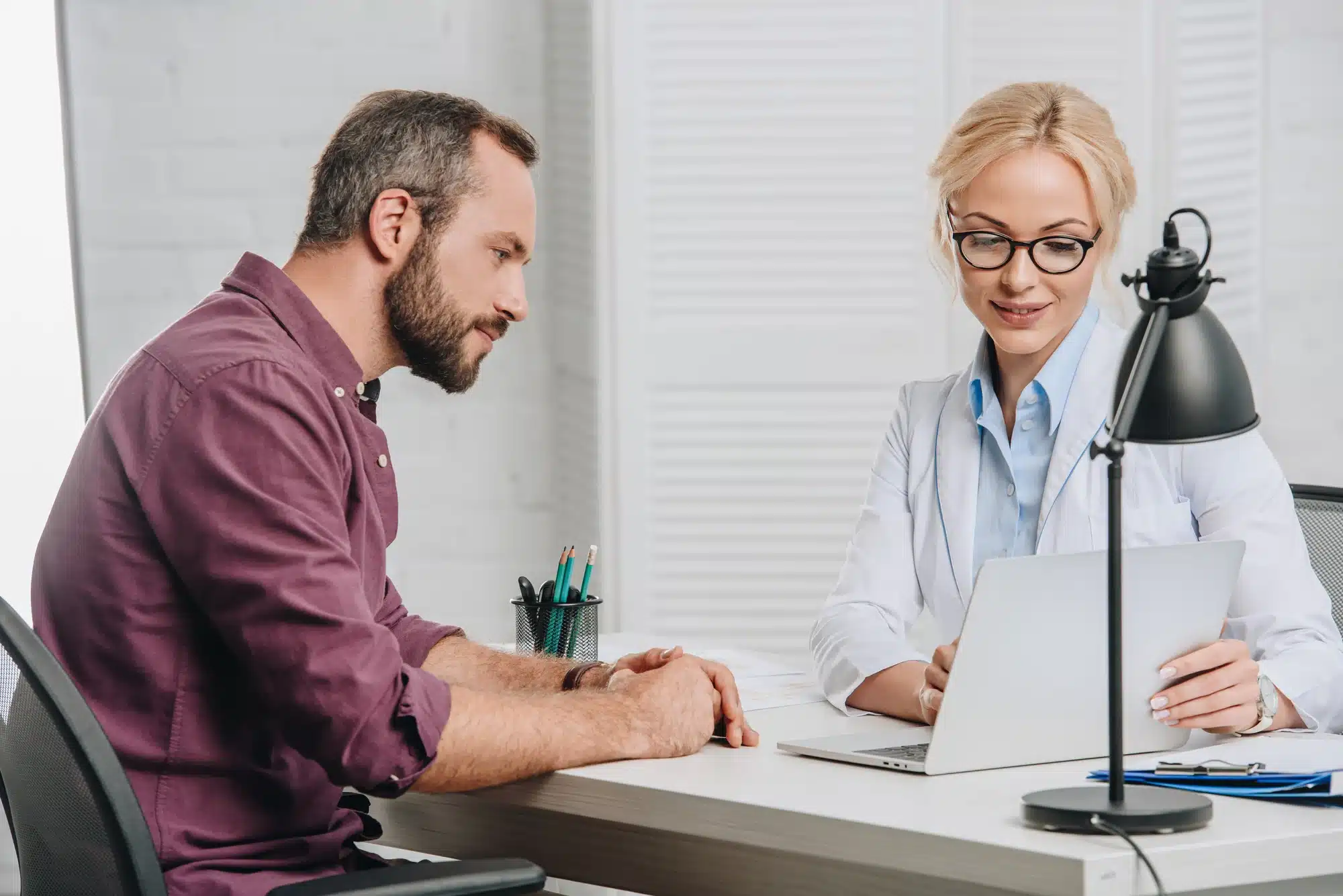 man consulting with doctor about botox for drooling treatment