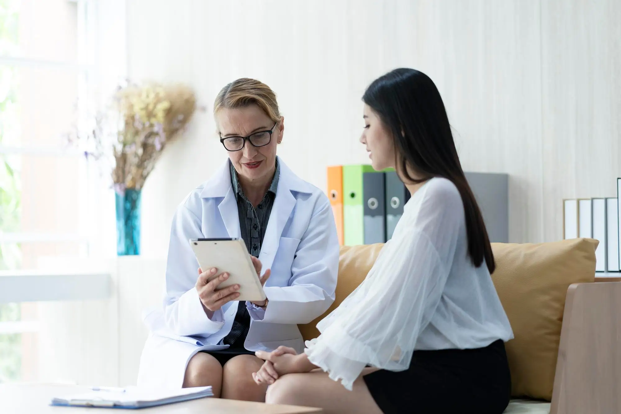 Doctor speaks to patient about aesthetic goals before proceeding to the treatment.