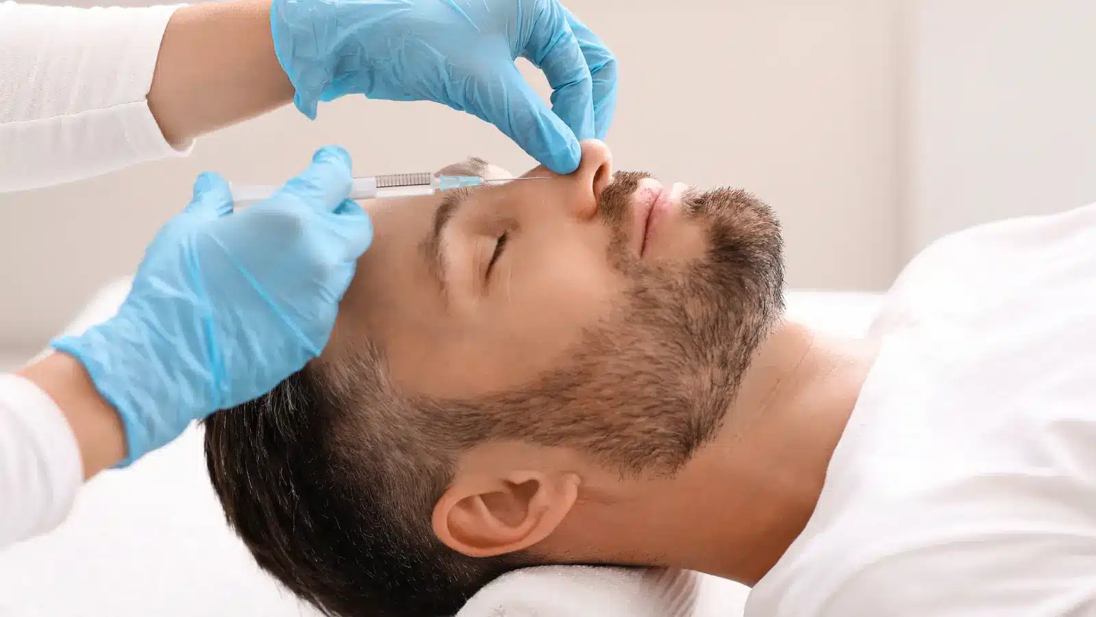 Man getting his nose injected.