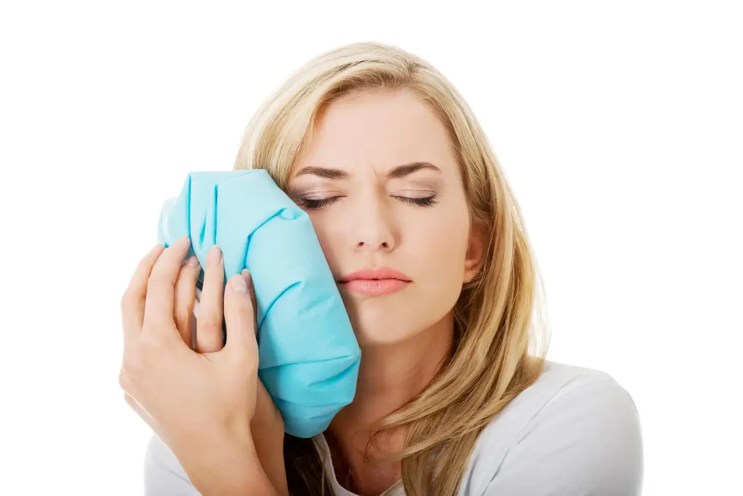 Woman icing her face.