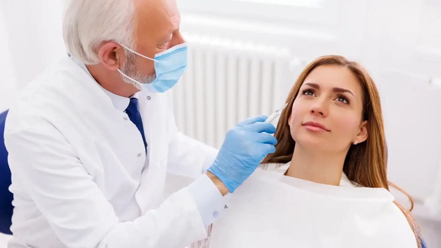 Woman getting facial injection.