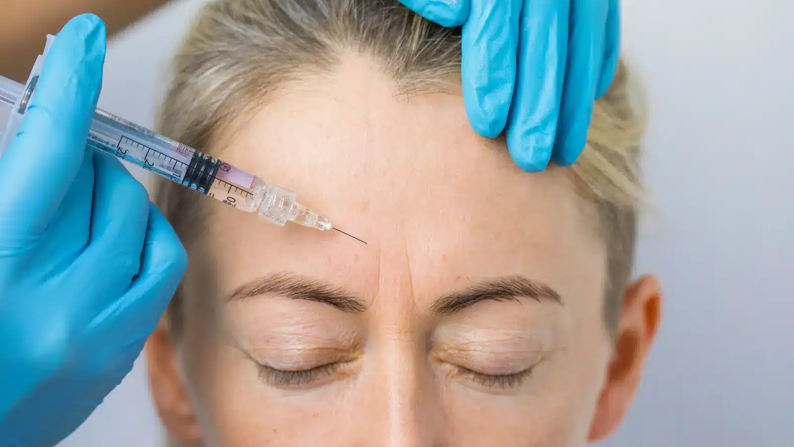 Woman getting an injection.