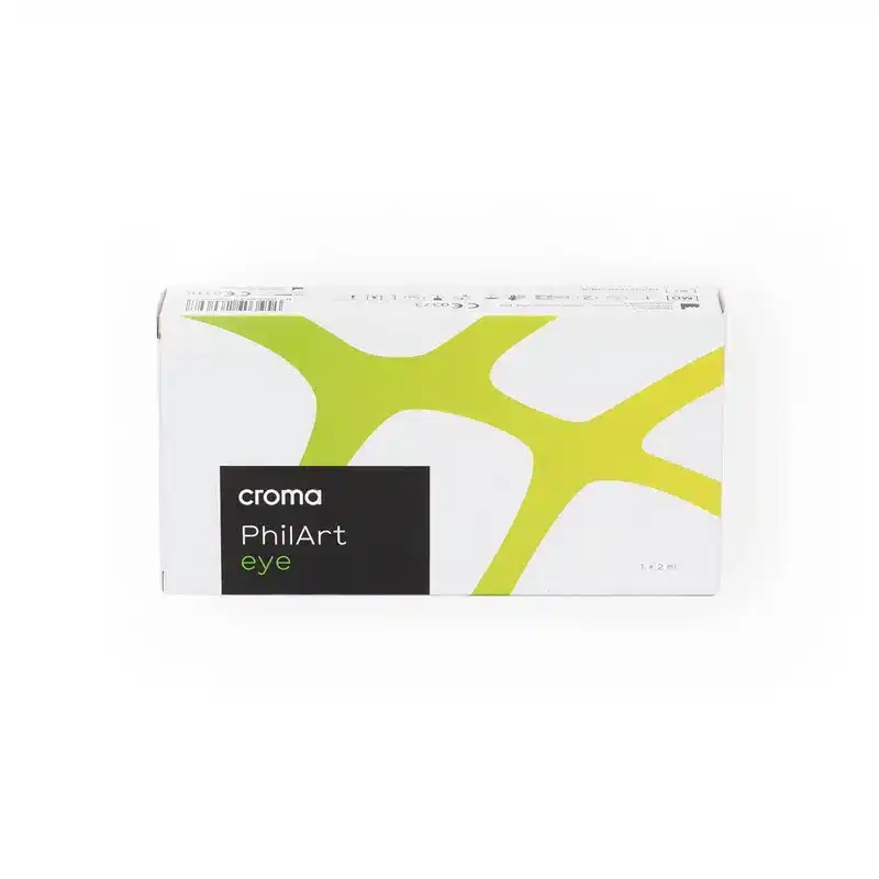 A white box with green abstract design elements and the brand name "Croma" printed on it. The product is named "CROMA PhilArt EYE" and is indicated to contain 1.2 ml of the product.